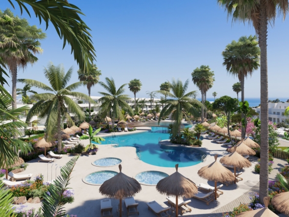 Illustrative communal pool and apartments beside golf in Alcaidesa