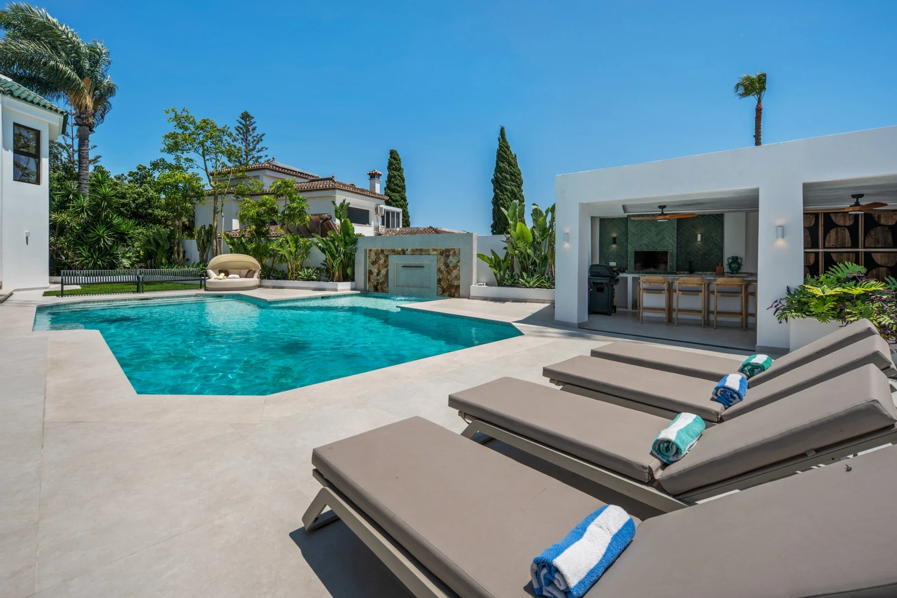 Poolside loungers and garden pavilion in Bel Air, Estepona