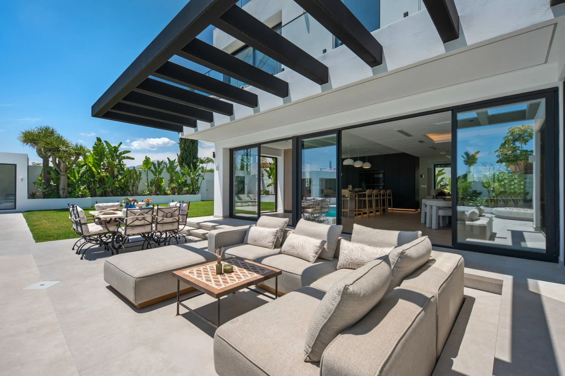 Covered outdoor lounge beside the pool in Bel Air, Estepona