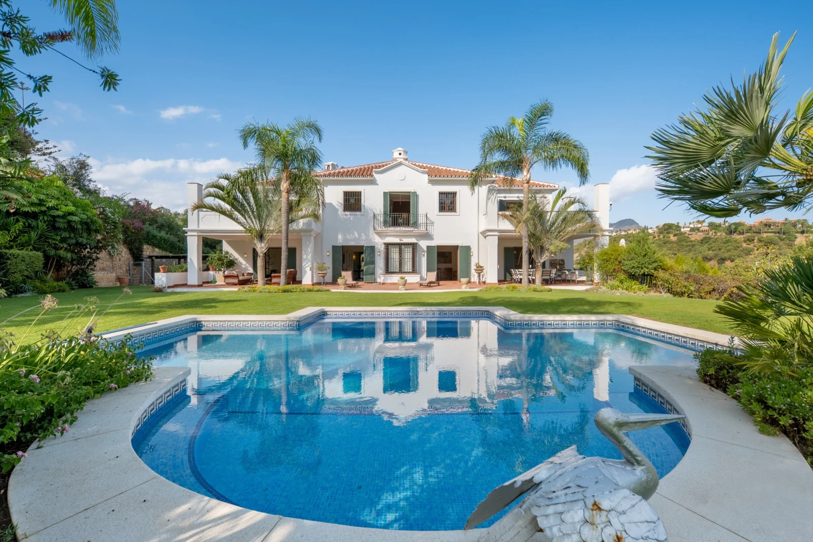 Mediterranean villa and private pool surrounded by mature gardens in Benahavis