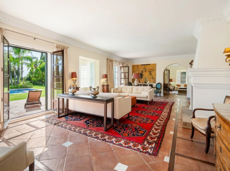 Living room with terracotta flooring and garden doors