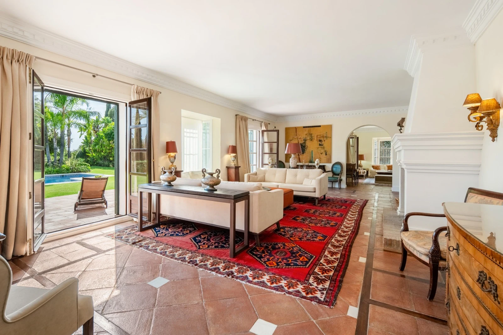 Living room with terracotta flooring and garden doors