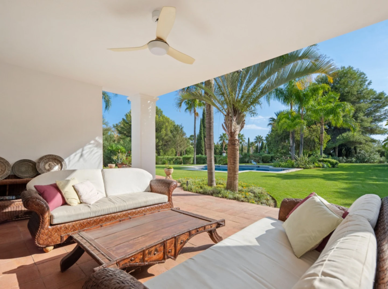 Shaded covered terrace overlooking the mature garden
