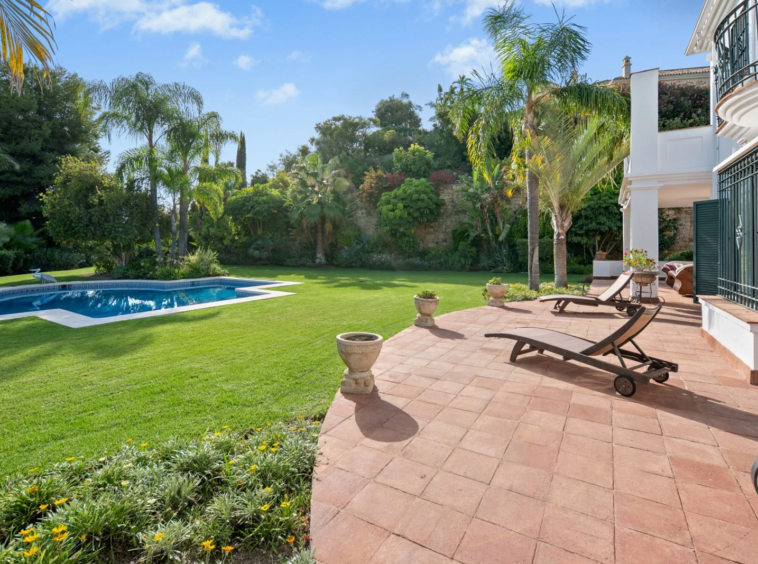 Sunny terrace beside the lawn and private swimming pool