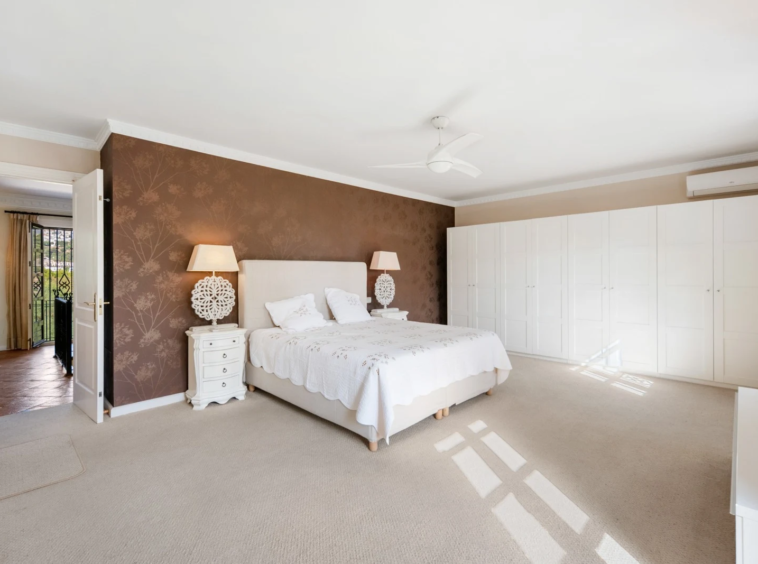 Bright bedroom with fitted wardrobes