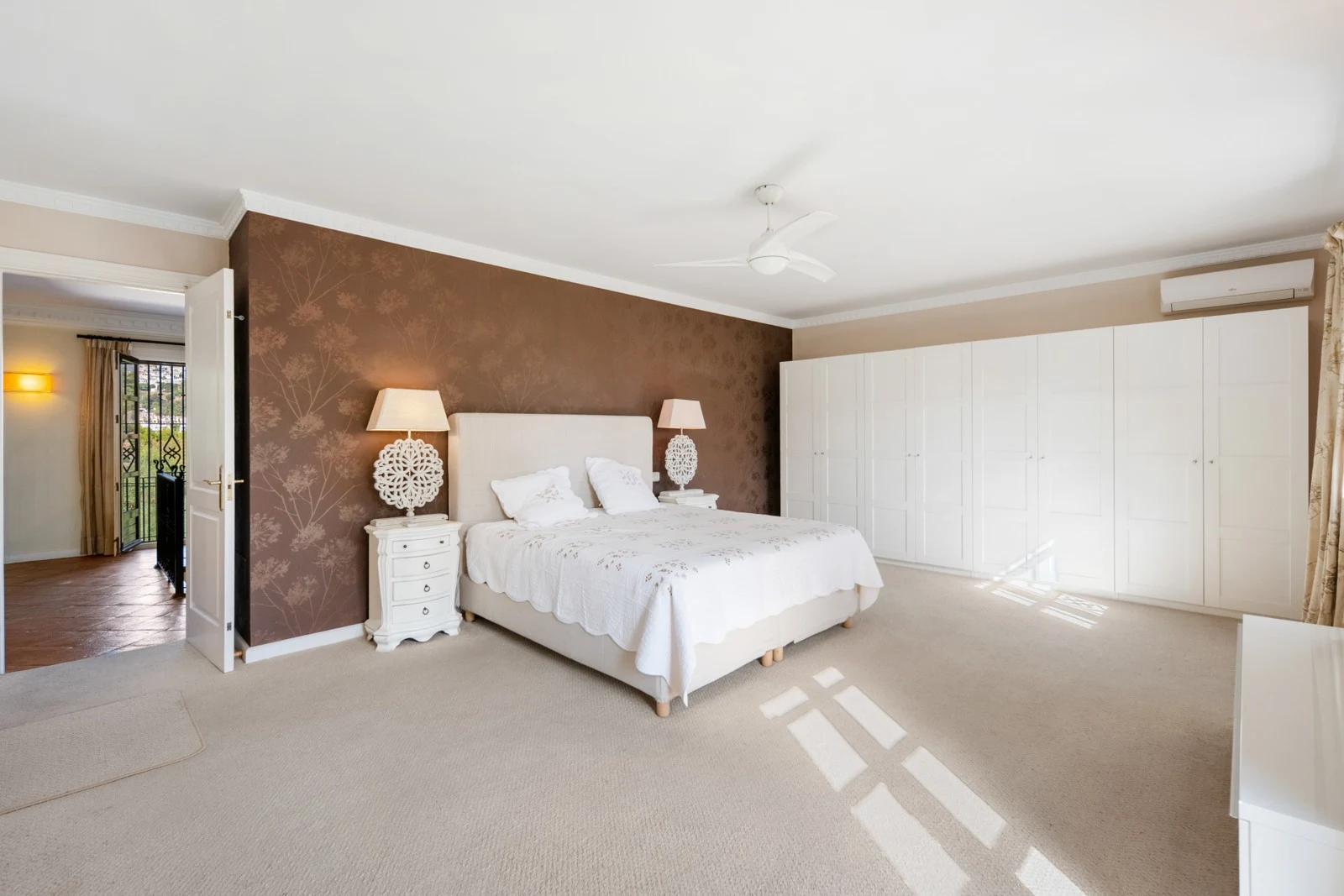 Bright bedroom with fitted wardrobes