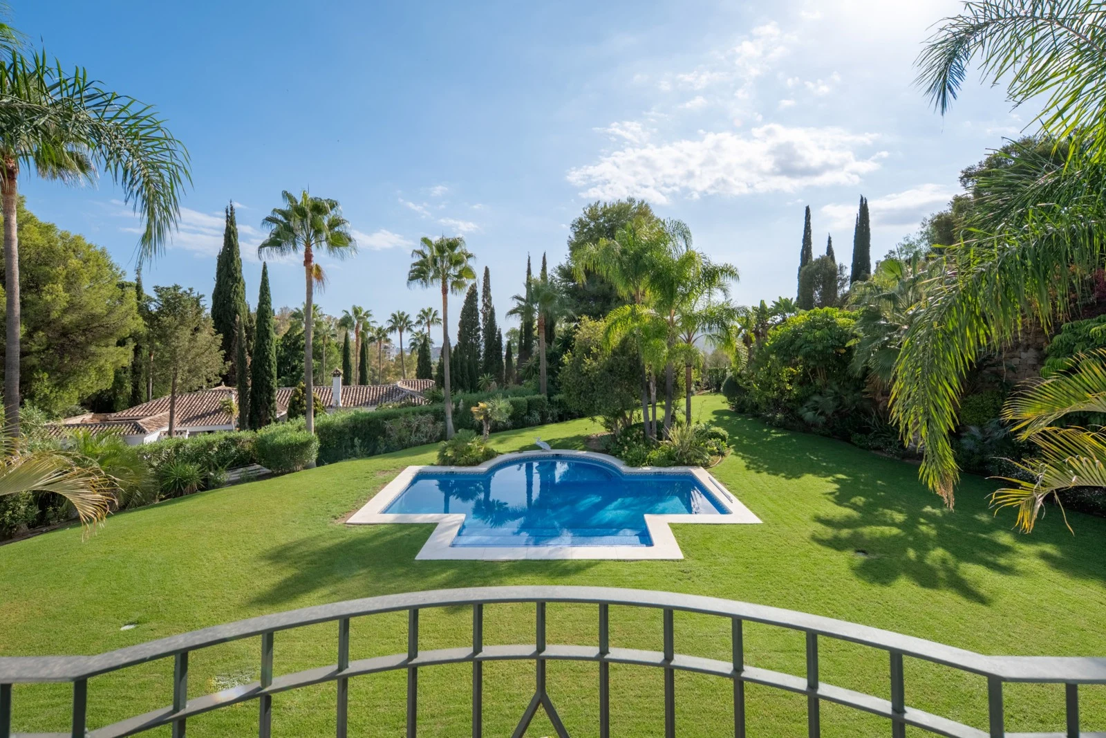 View across the private pool and mature garden