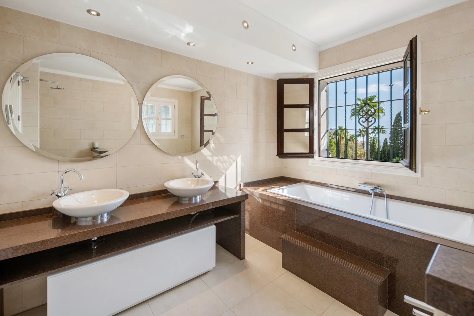Bathroom with double basin and bathtub