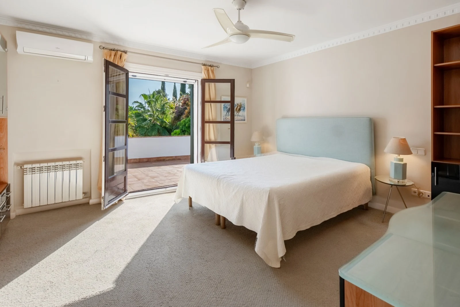 Bedroom with timber-framed garden doors