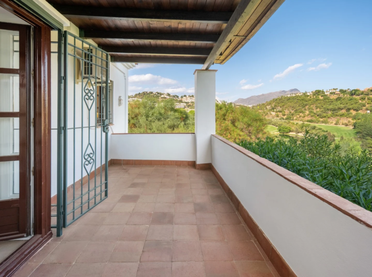 Covered balcony with views towards the mountains