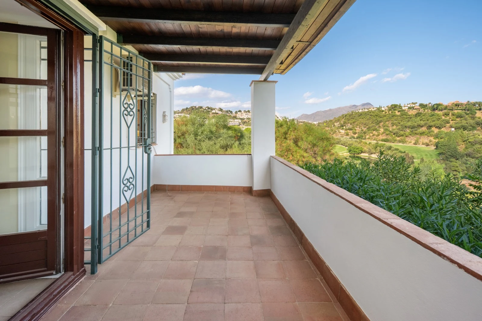 Covered balcony with views towards the mountains