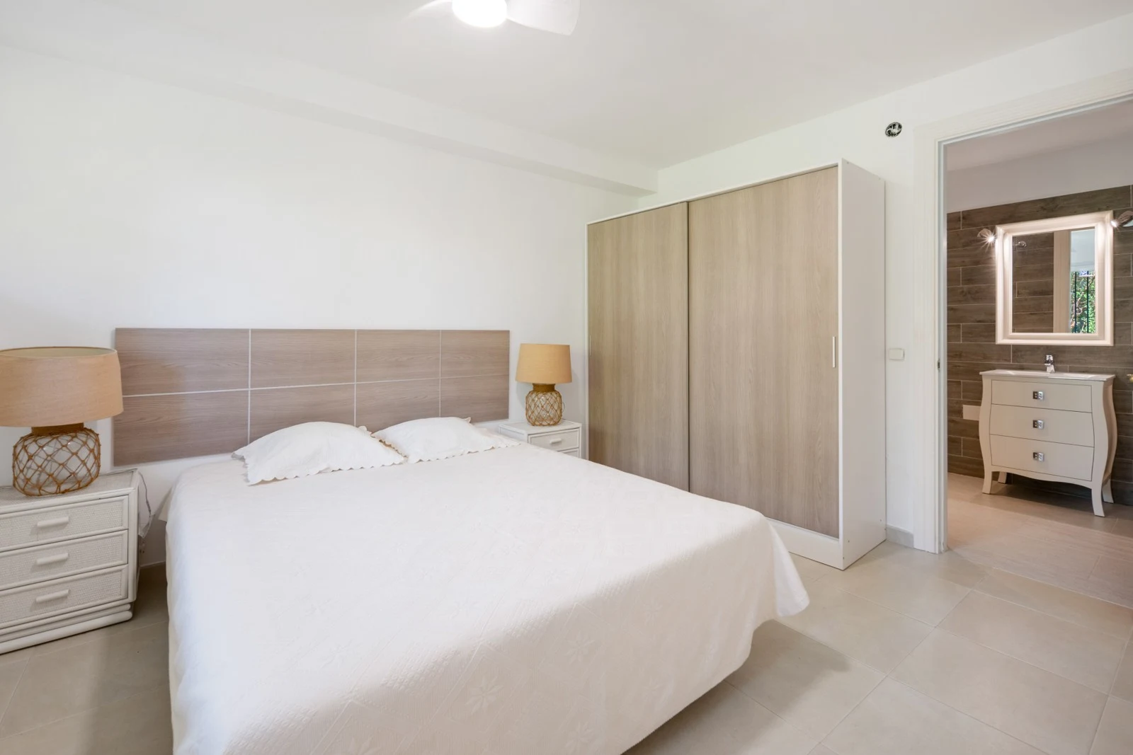 Bedroom with fitted wardrobes and natural light