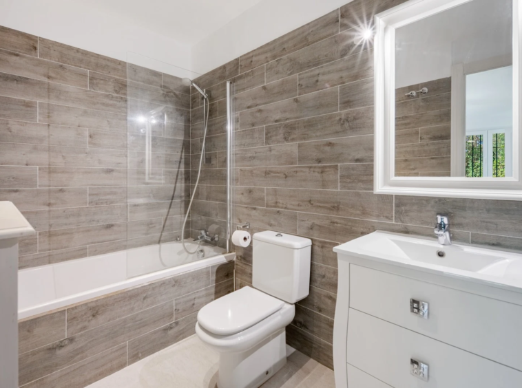 Bathroom with bathtub and stone finishes