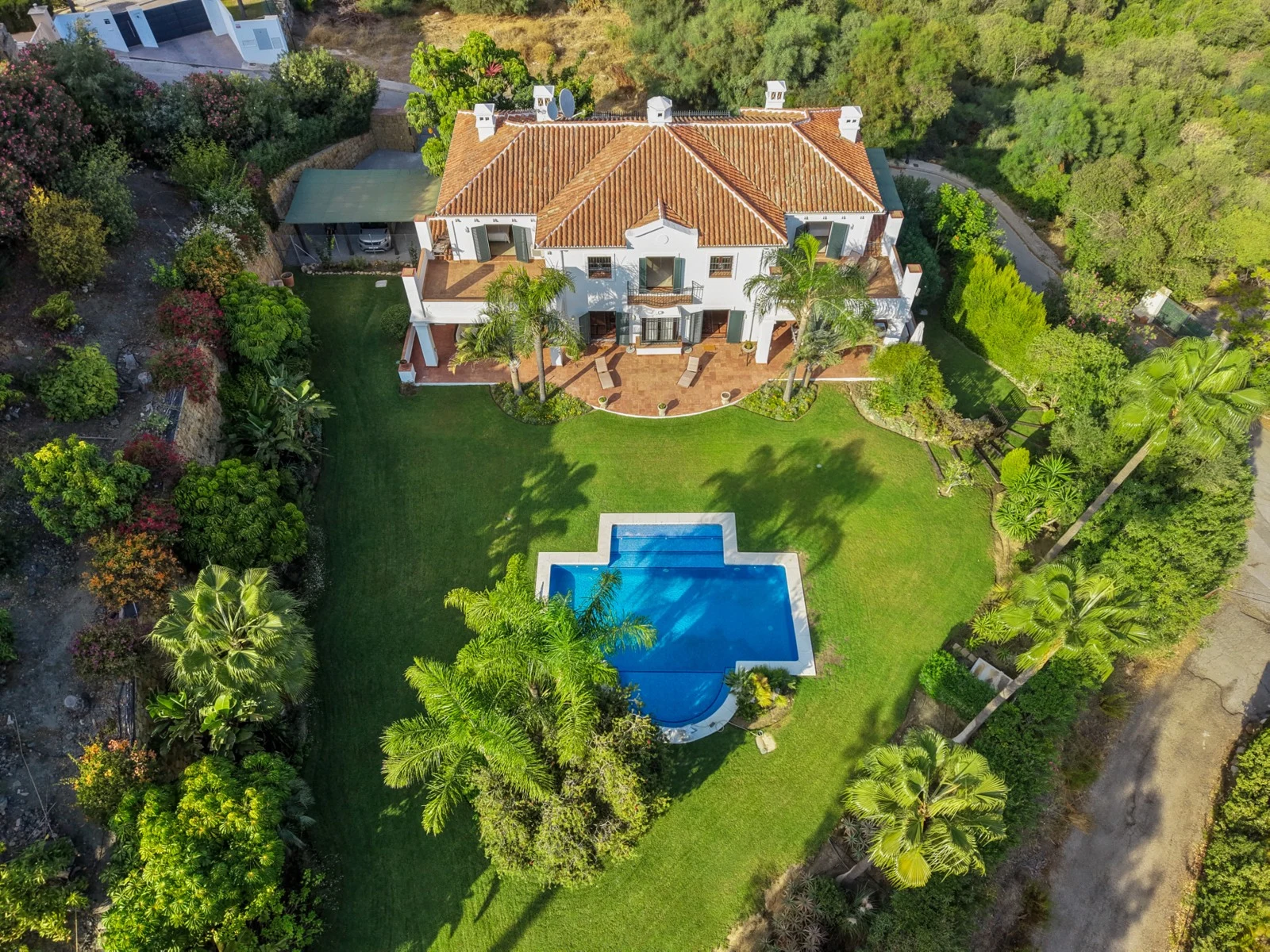Aerial view of the villa and private landscaped plot
