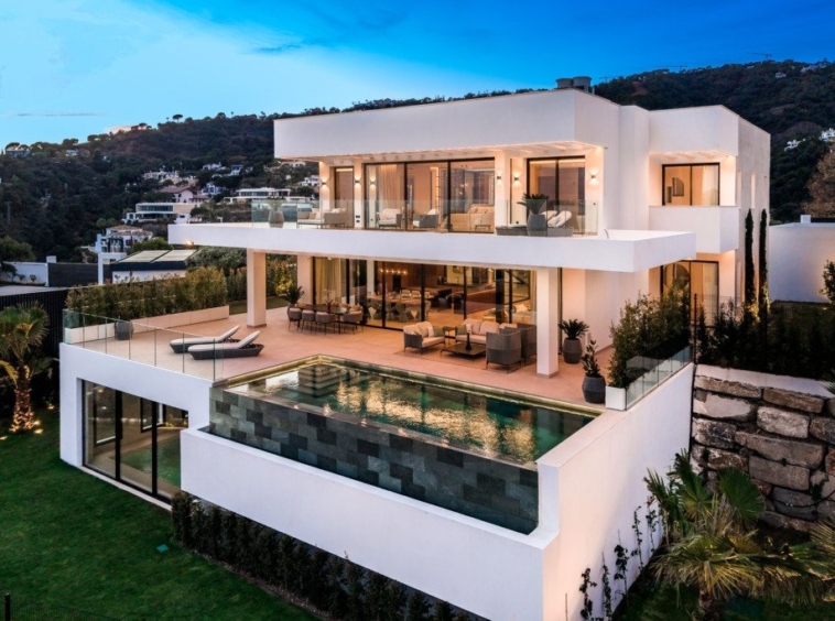 Villa and private pool at dusk