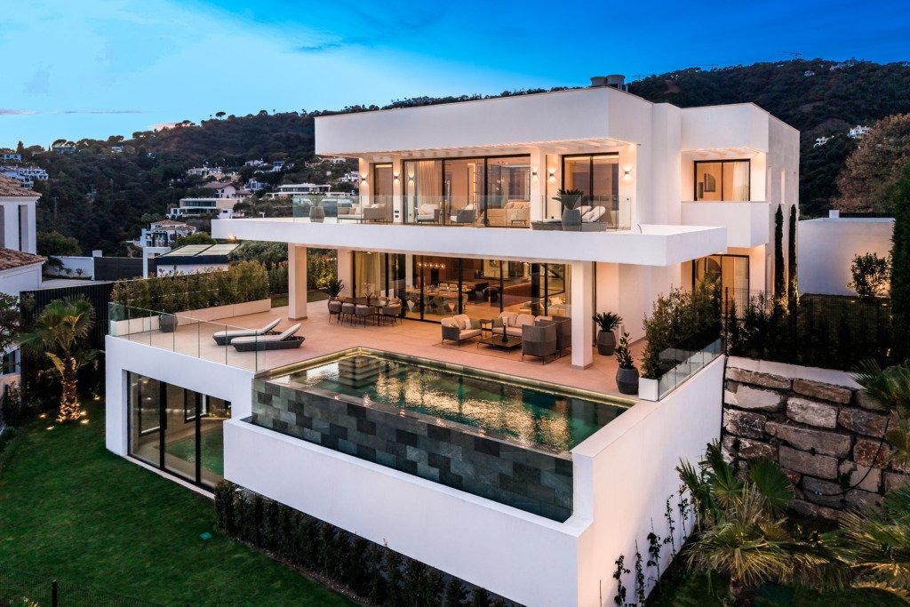 Villa and private pool at dusk