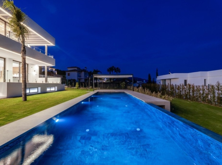 Illuminated private swimming pool at night