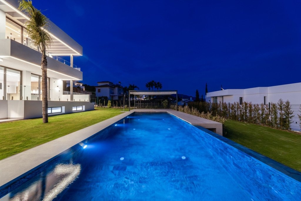 Illuminated private swimming pool at night
