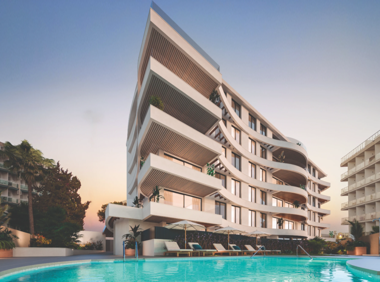 Illustrative apartment building and communal swimming pool in Benalmadena