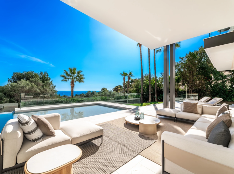 Poolside covered lounge with views towards the Mediterranean