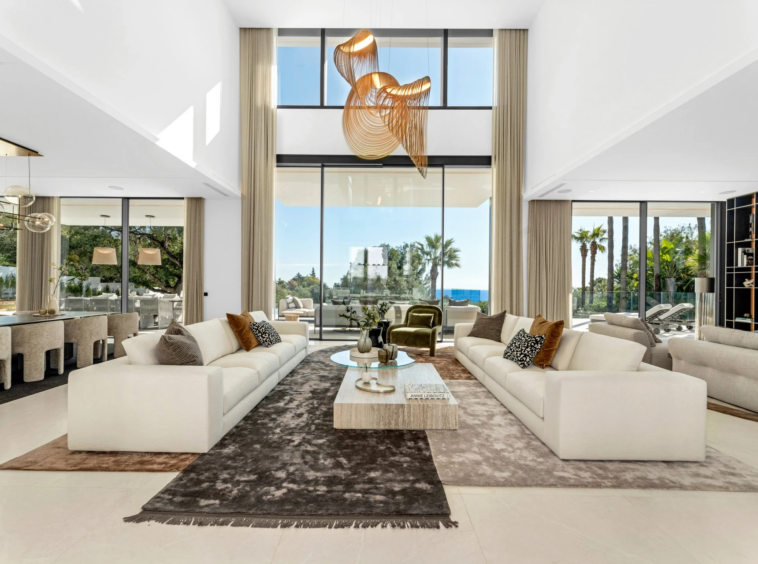 Double-height living room with floor-to-ceiling glazing
