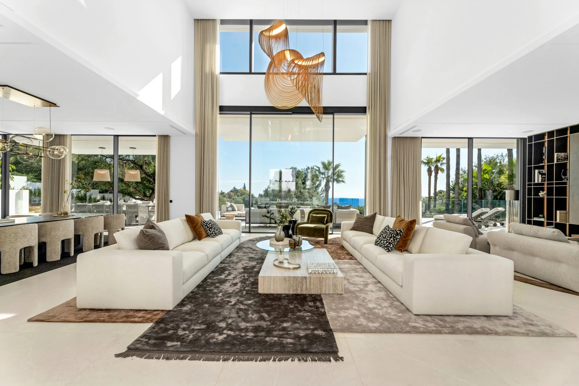 Double-height living room with floor-to-ceiling glazing