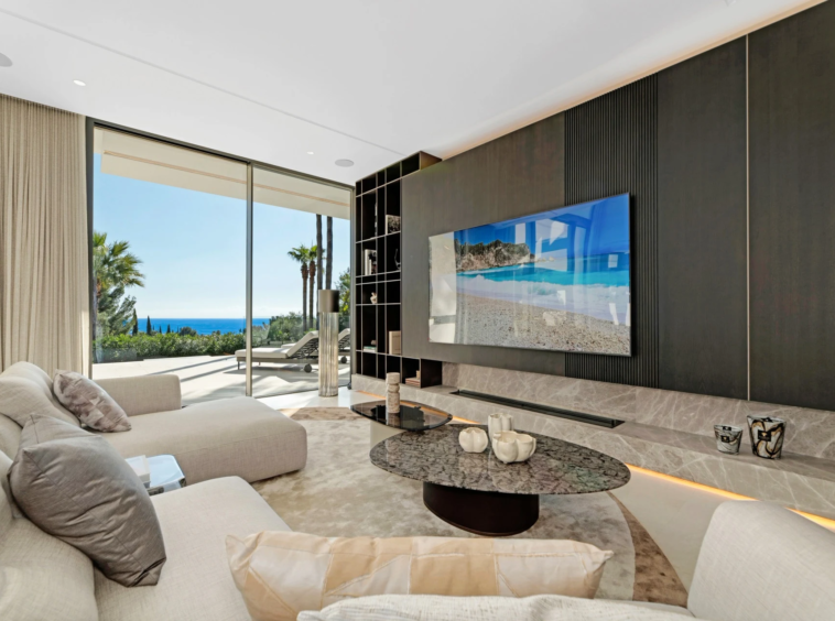 Television lounge opening onto a sea-view terrace