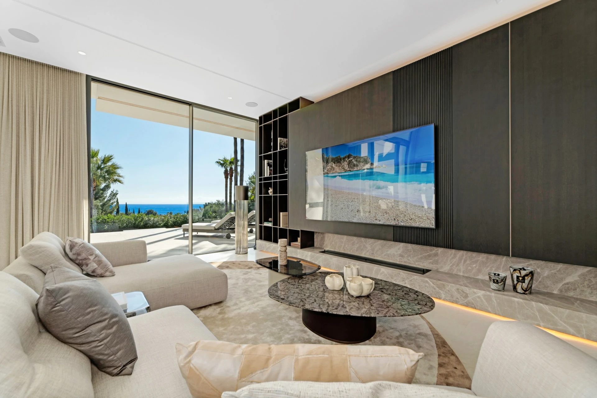 Television lounge opening onto a sea-view terrace