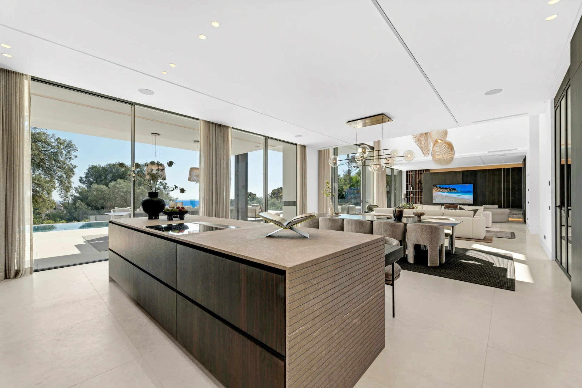 Contemporary kitchen with central island and integrated appliances