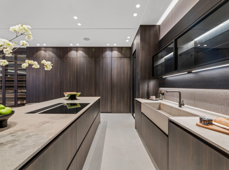 Separate service kitchen with fitted cabinets