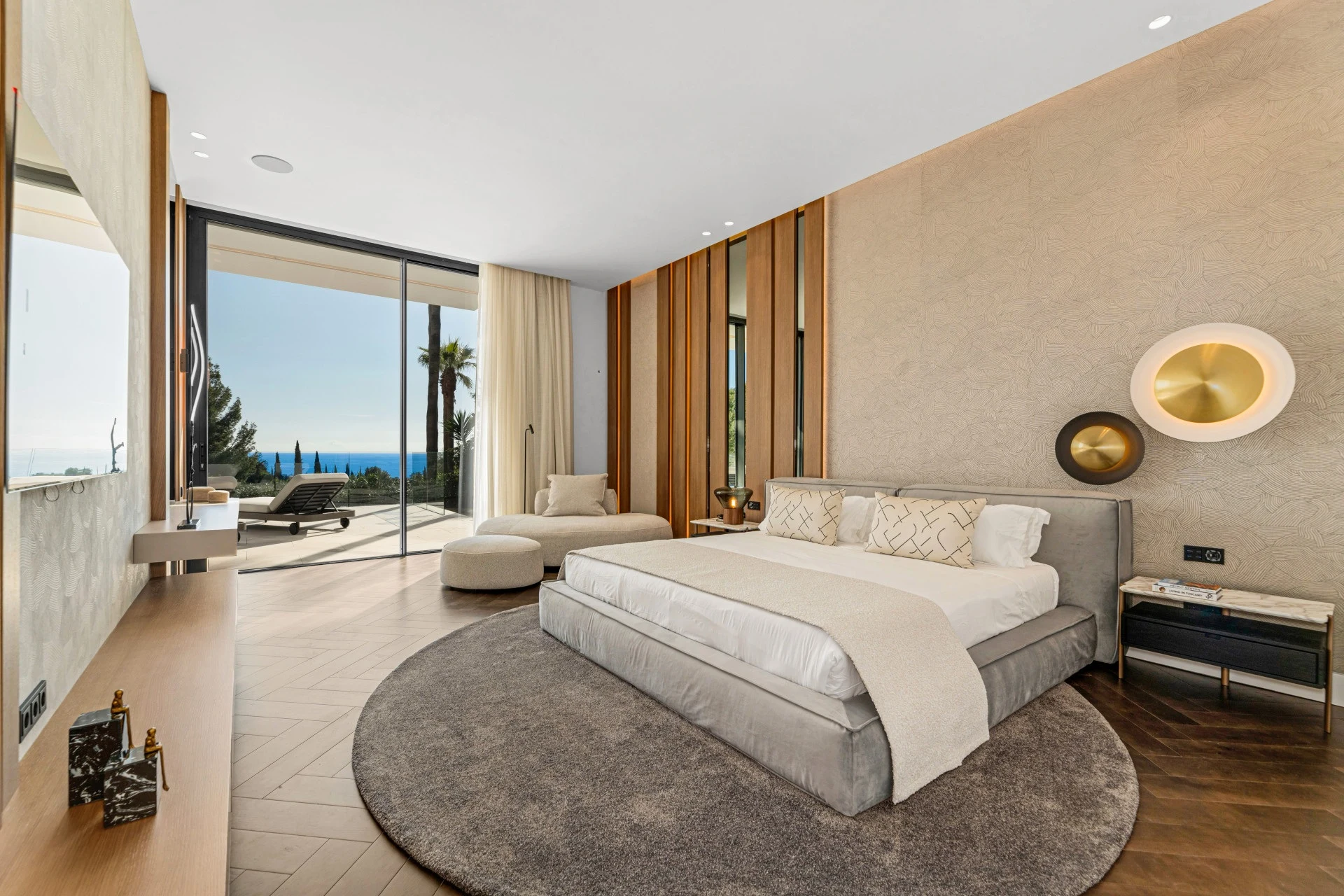 Principal bedroom with coastal views and terrace access