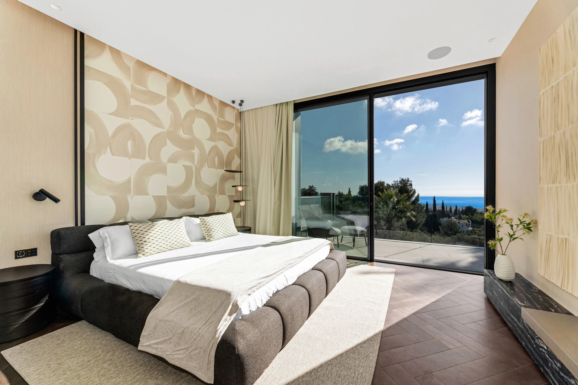Bedroom with glazed doors and sea views