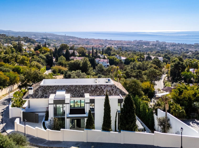 Aerial view of the villa and surrounding coastline