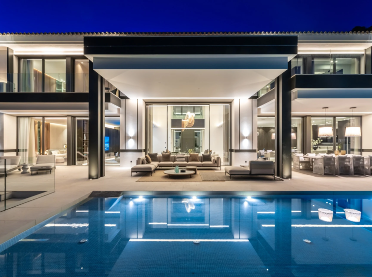 Illuminated terrace and swimming pool in the evening