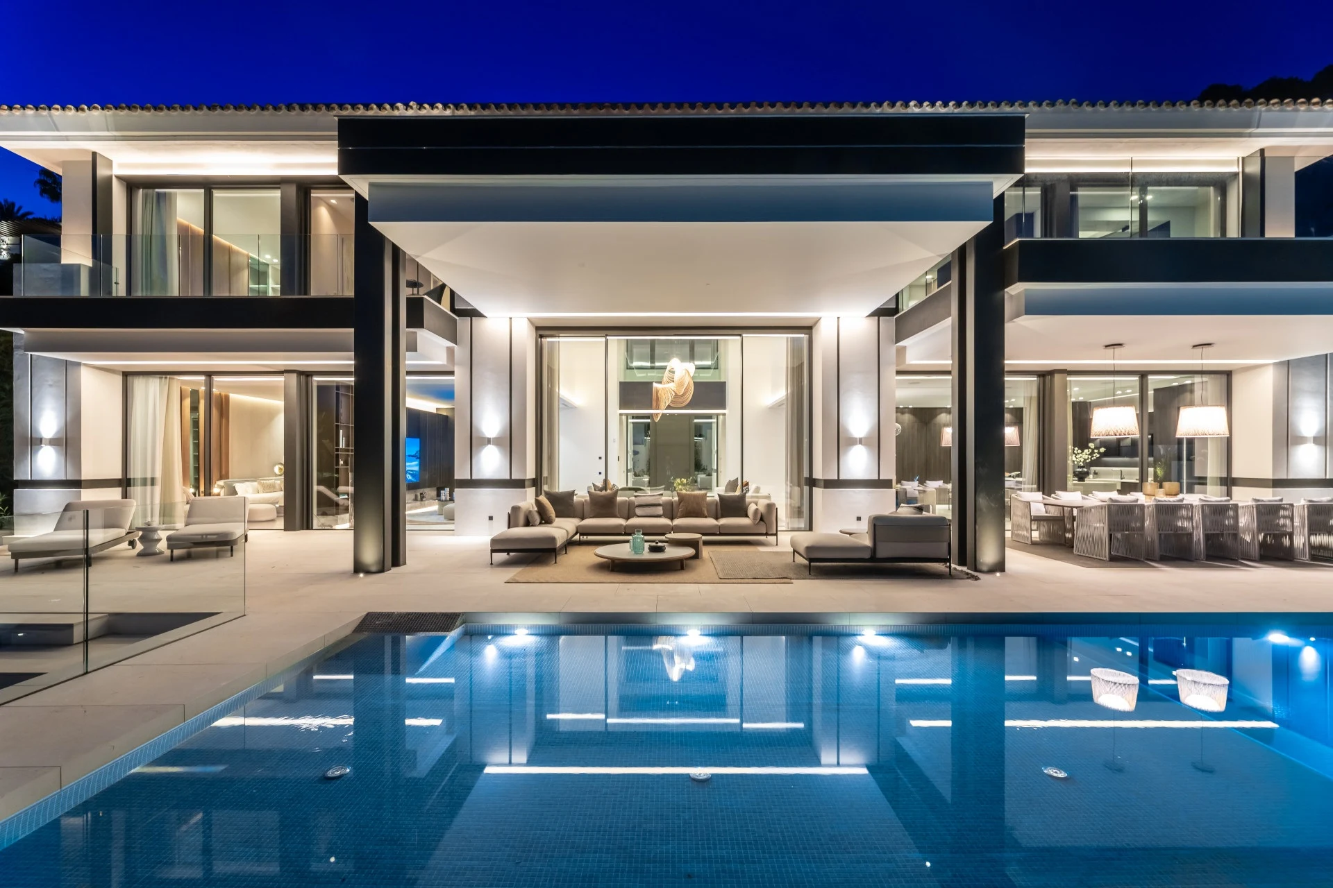 Illuminated terrace and swimming pool in the evening