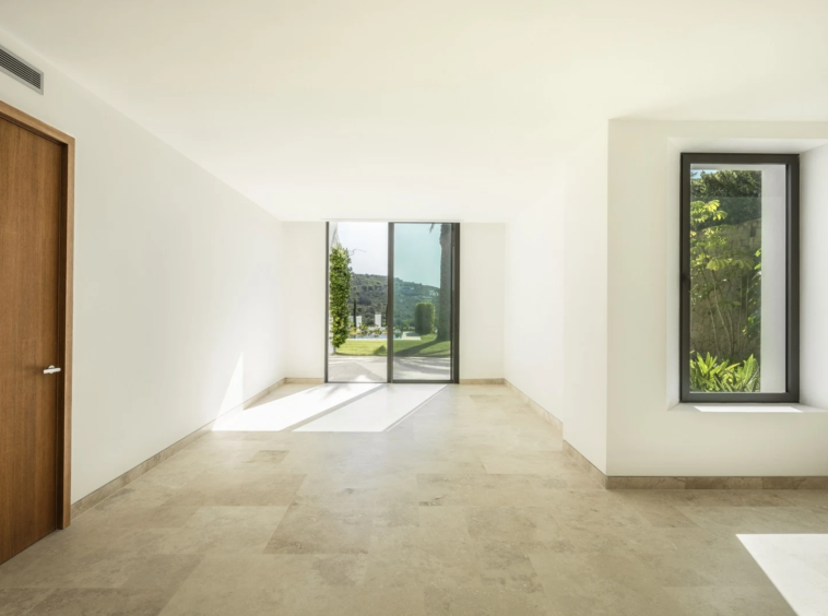 Bright bedroom with fitted wardrobes and garden access