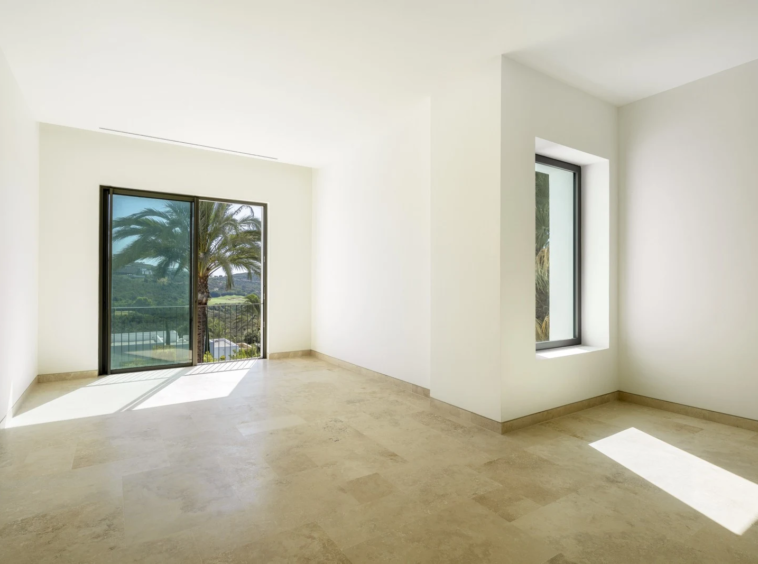 Bedroom with two windows overlooking the garden