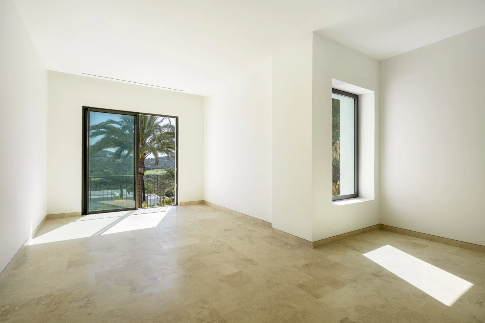 Bedroom with two windows overlooking the garden