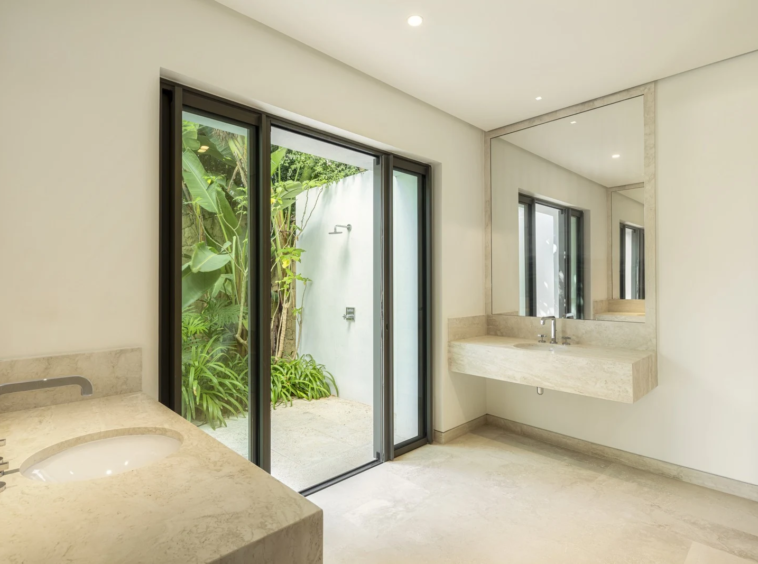 Bathroom with garden-facing windows
