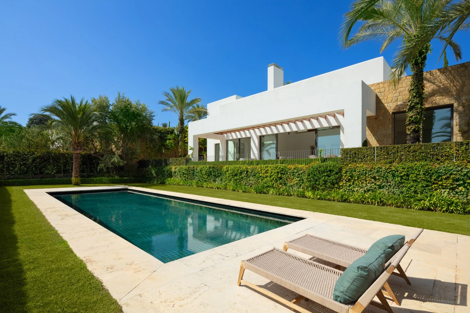 Private swimming pool and landscaped garden at a six-bedroom villa in Casares
