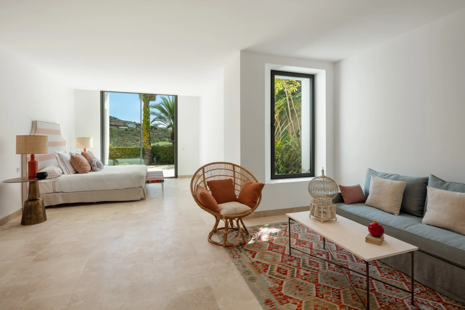 Spacious bedroom with lounge area and garden access