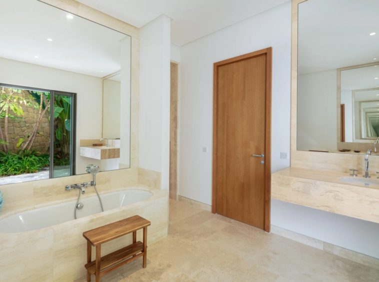 En-suite bathroom with double vanity and natural light