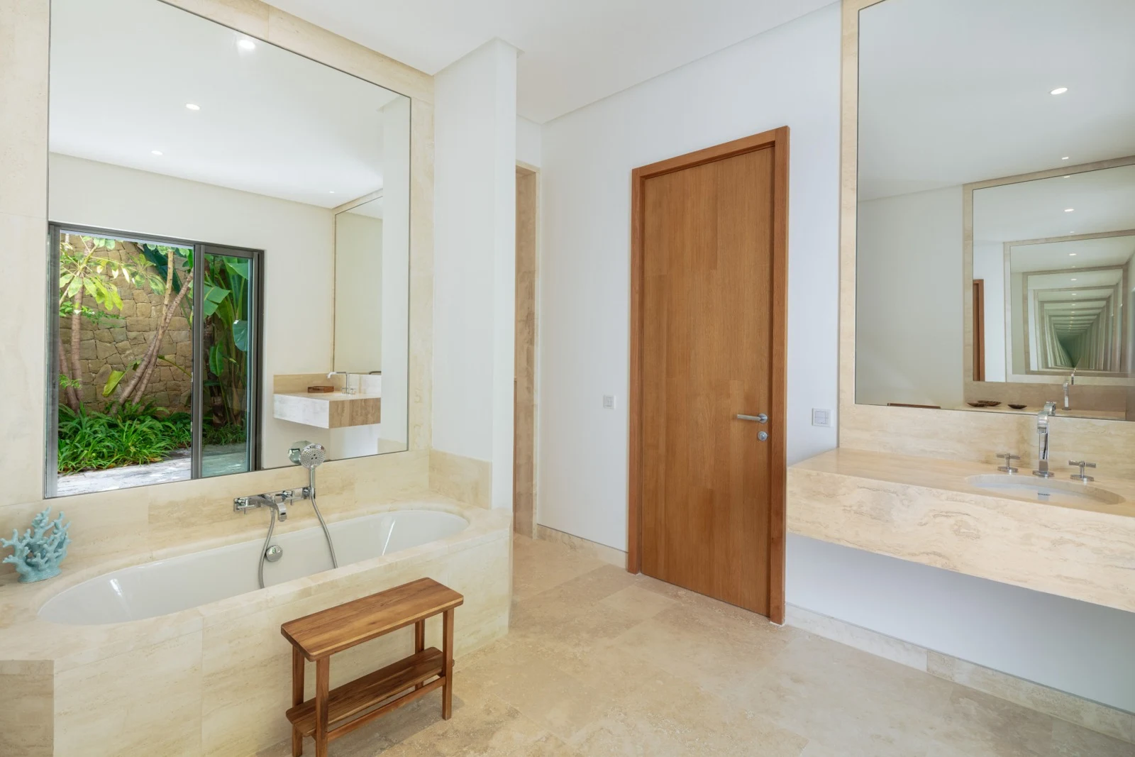 En-suite bathroom with double vanity and natural light