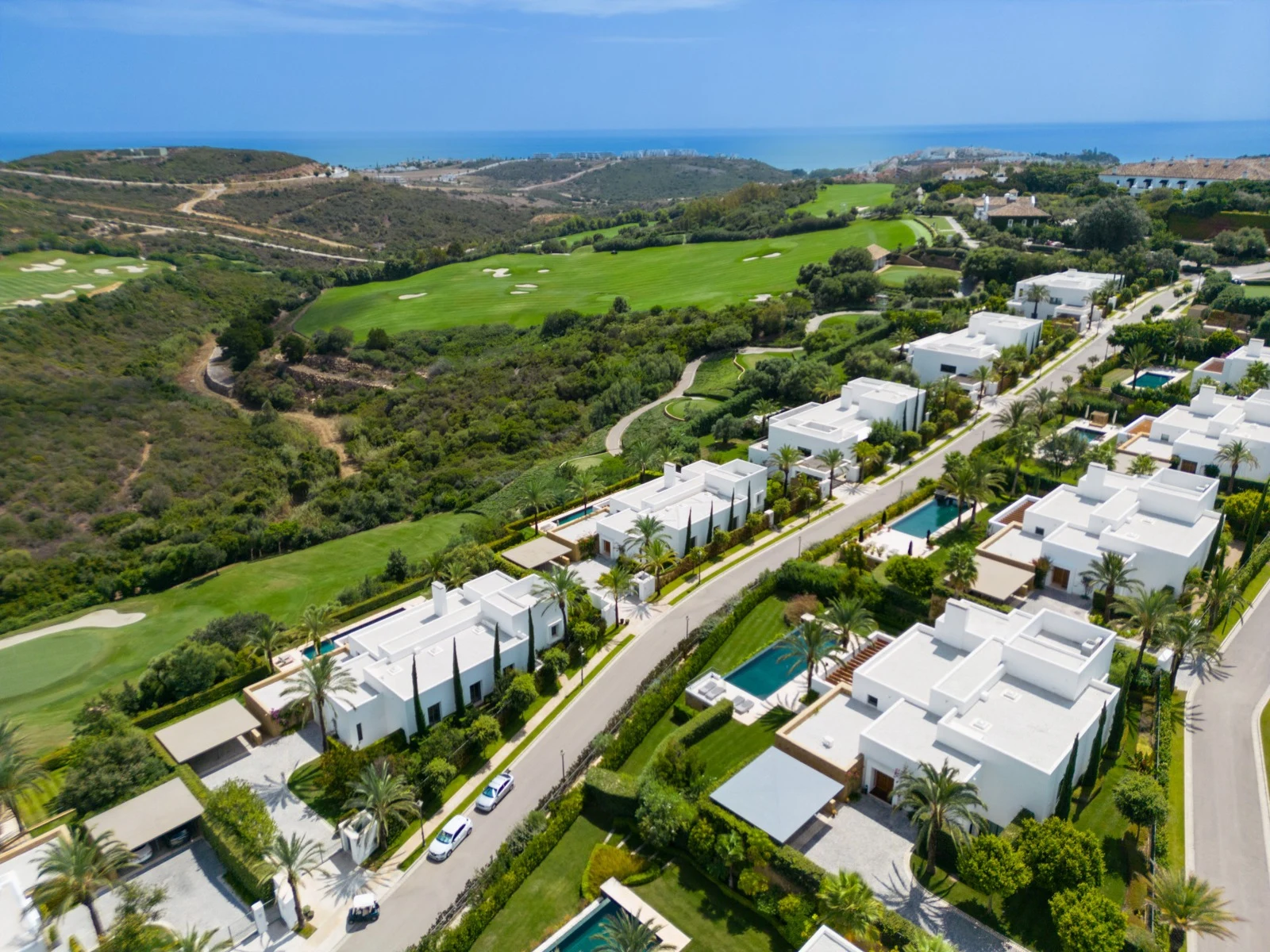 Aerial view across the Casares golf setting toward the coast
