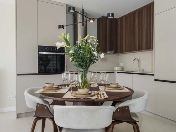 Modern kitchen and dining area in a three-bedroom apartment in Benahavis