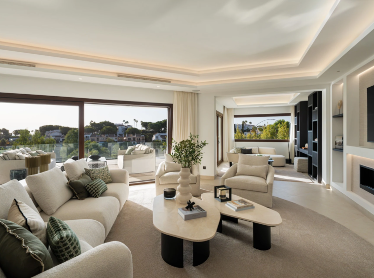 Bright living room opening onto the pool terrace