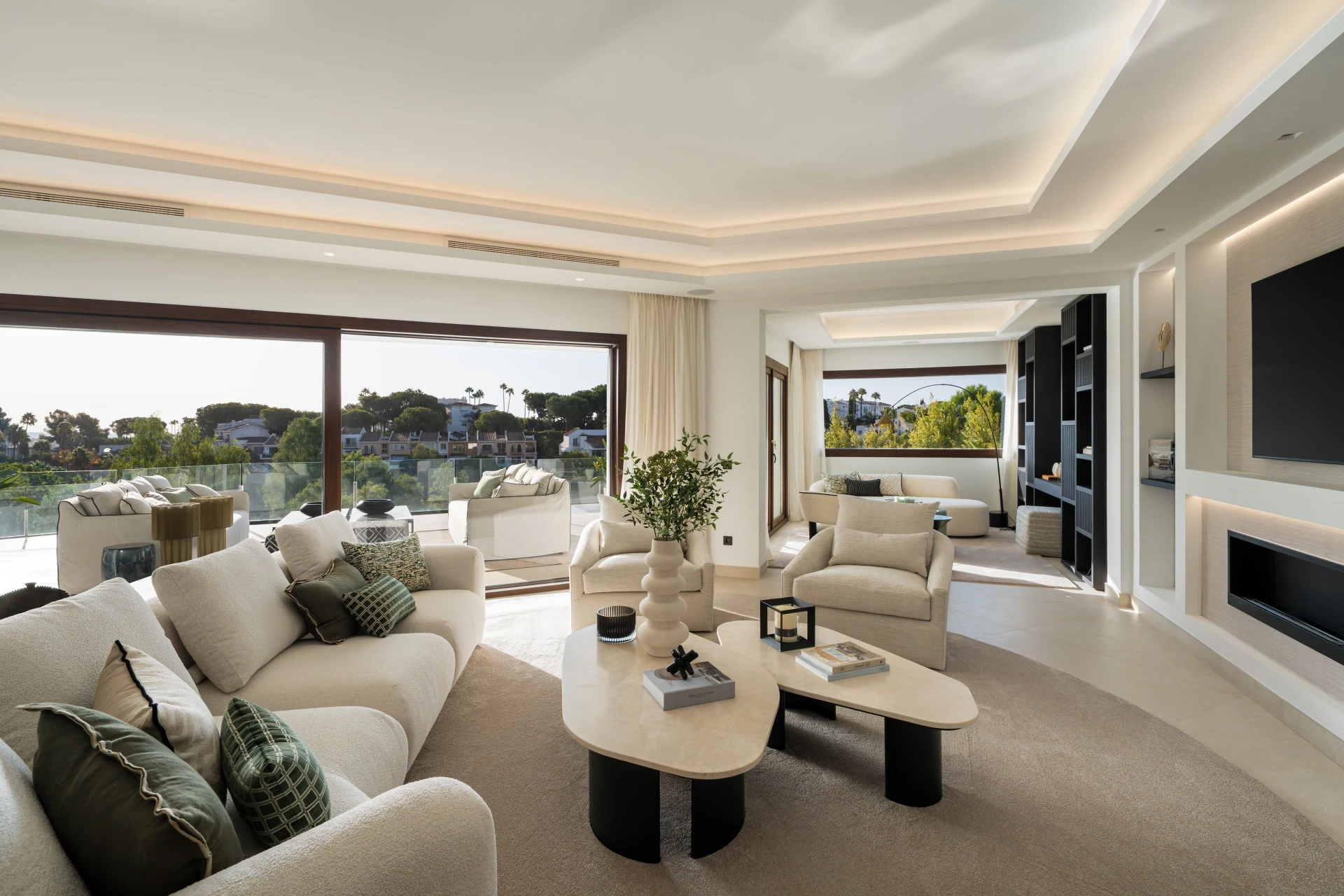 Bright living room opening onto the pool terrace