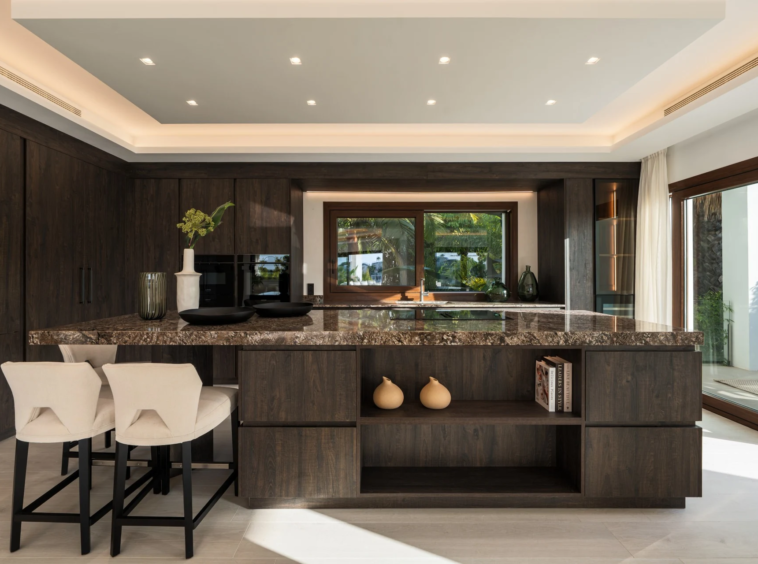 Modern kitchen with stone island and breakfast seating
