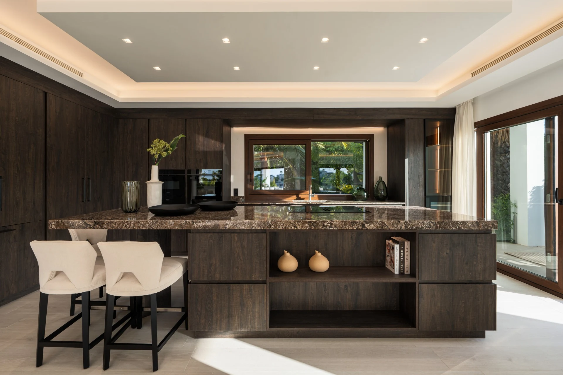 Modern kitchen with stone island and breakfast seating