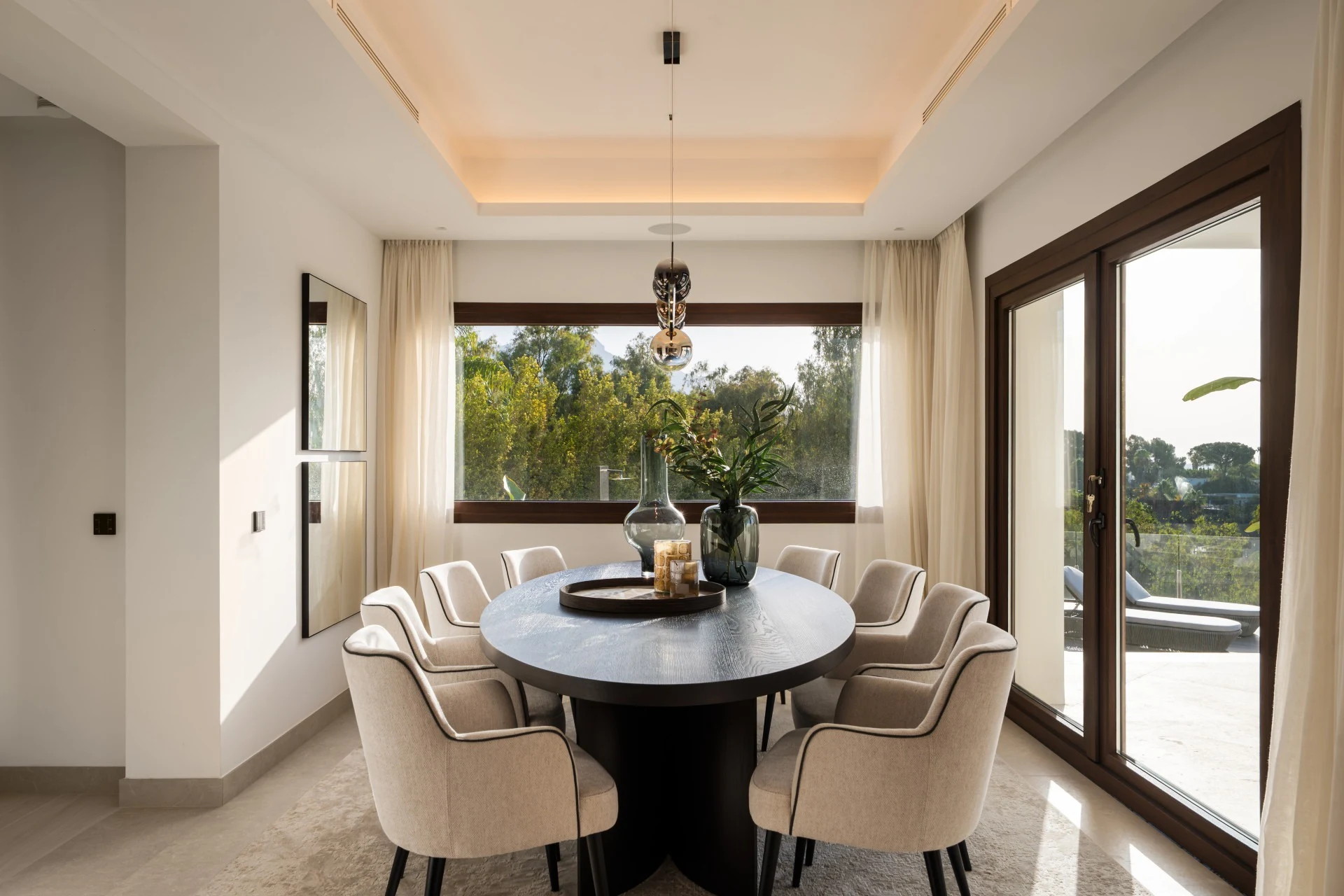 Dining room with round table and broad windows